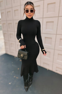 VESTIDO NEGRO TEJIDO PEPLUM
